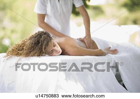 Stock Image - Woman having a massage. Fotosearch