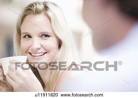 Stock Image - Woman having some coffee. Fotosearch