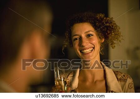 Woman having wine outdoors at night View Large Photo Image Stock Photography - Woman having wine outdoors at night. Fotosearch