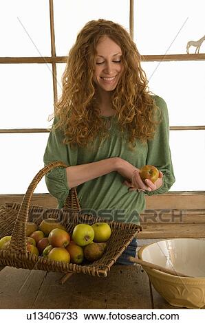 Woman holding basket of apples View Large Photo Image Stock Image - Woman holding basket of apples. Fotosearch