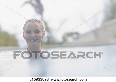Woman in a pool View Large Photo Image Stock Image - Woman in a pool. Fotosearch