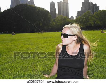 Picture - Woman in central park, enjoying the view. Fotosearch