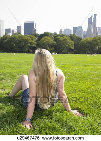 Woman in central park, enjoying the view View Large Photo Image Stock Photograph - Woman in central park, enjoying the view. Fotosearch