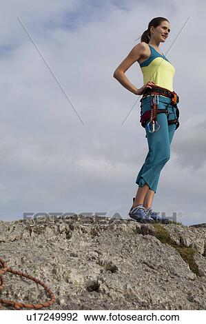 woman in climbing gear on top of rock View Large Photo Image Stock Image - woman in climbing gear on top of rock. Fotosearch
