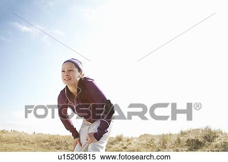Woman in fitness clothing outside View Large Photo Image Stock Photography - Woman in fitness clothing outside. Fotosearch
