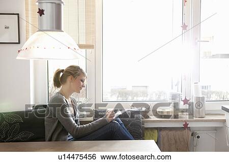 Woman in ktchen, writing View Large Photo Image Stock Photograph - Woman in ktchen, writing. Fotosearch