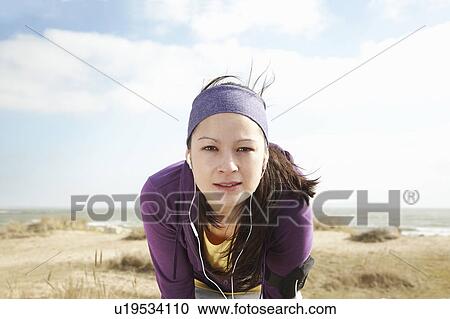Woman in sports clothes by the sea View Large Photo Image Stock Image - Woman in sports clothes by the sea. Fotosearch