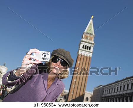 Picture - Woman in Venice, taking pictures. Fotosearch