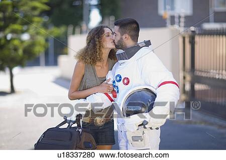 Woman kissing an astronaut View Large Photo Image Stock Image - Woman kissing an astronaut. Fotosearch