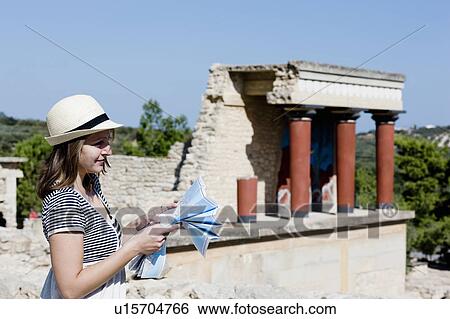 woman looking and holding a map in front of temple View Large Photo Image Stock Photograph - woman looking and holding a map in front of temple. Fotosearch