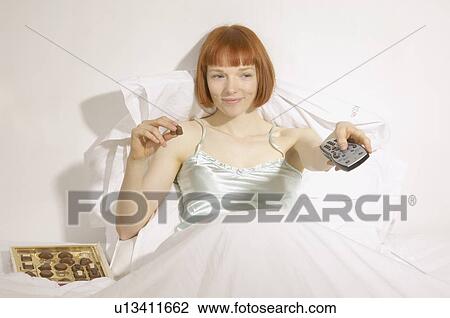 woman looking at reflection in mirror View Large Photo Image Stock Image - woman looking at reflection in mirror. Fotosearch