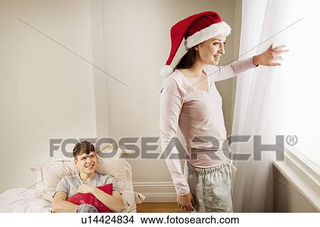 Woman looking out of window View Large Photo Image Picture - Woman looking out of window. Fotosearch
