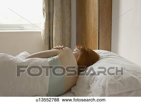 woman lying in bed View Large Photo Image Stock Photo - woman lying in bed. Fotosearch