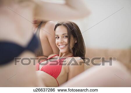 Woman lying on the beach View Large Photo Image Stock Photograph - Woman lying on the beach. Fotosearch