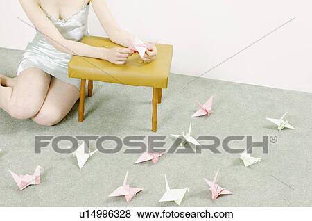 woman making origami swans View Large Photo Image Stock Photo - woman making origami swans. Fotosearch