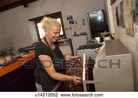 Woman making pralines View Large Photo Image Stock Image - Woman making pralines. Fotosearch
