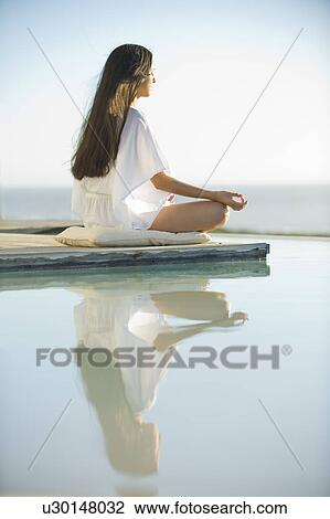 Woman meditating View Large Photo Image Stock Image - Woman meditating. Fotosearch