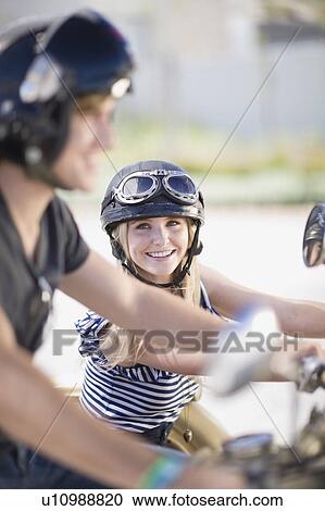Stock Image - Woman on a motorbike. Fotosearch