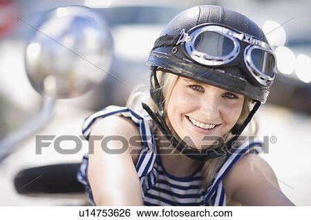 Woman on a motorbike View Large Photo Image Stock Photograph - Woman on a motorbike. Fotosearch