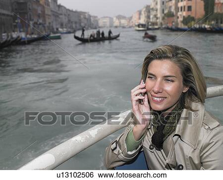 Woman on the phone, on boat View Large Photo Image Stock Photograph - Woman on the phone, on boat. Fotosearch