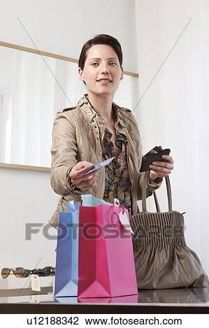 woman paying for shopping View Large Photo Image Stock Image - woman paying for shopping. Fotosearch