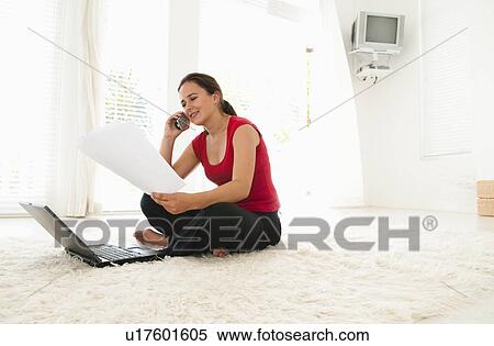 Woman pays over the phone View Large Photo Image Stock Photography - Woman pays over the phone. Fotosearch