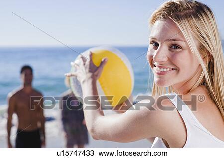 Woman playing with ball on beach View Large Photo Image Stock Image - Woman playing with ball on beach. Fotosearch