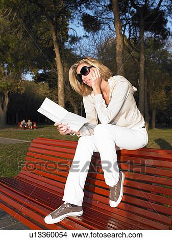 Picture - Woman reading a letter. Fotosearch