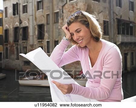 Woman reading a letter View Large Photo Image Stock Image - Woman reading a letter. Fotosearch