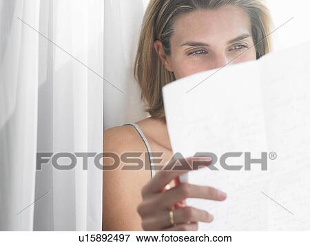 Stock Photo - Woman reading a letter. Fotosearch