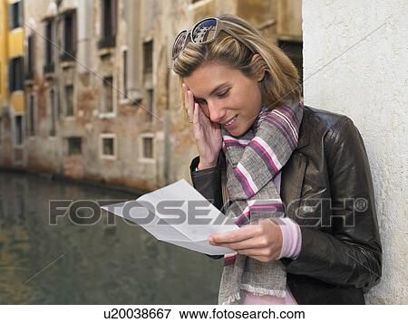 Woman reading a letter View Large Photo Image Stock Photo - Woman reading a letter. Fotosearch