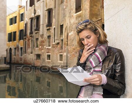 Woman reading a letter View Large Photo Image Stock Photo - Woman reading a letter. Fotosearch