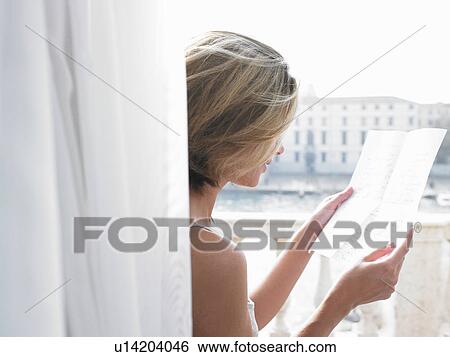 Stock Photograph - Woman reading a letter. Fotosearch
