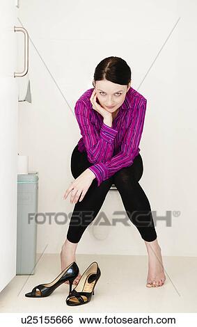 Woman relaxes in toilet View Large Photo Image Stock Photograph - Woman relaxes in toilet. Fotosearch