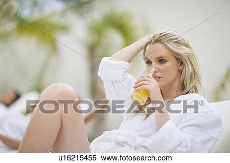 Stock Photography - Woman relaxing in a spa on deckchair. Fotosearch
