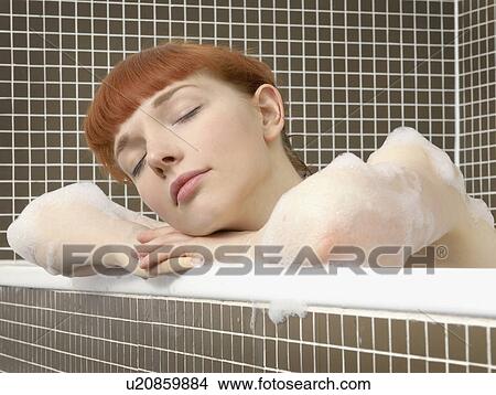 Picture - woman relaxing in bath. Fotosearch