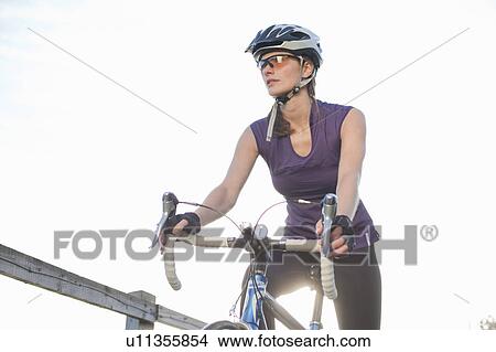 woman riding a road bike View Large Photo Image Picture - woman riding a road bike. Fotosearch