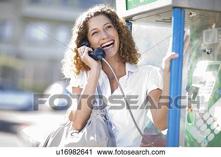 Stock Image - Woman ringing a friend. Fotosearch