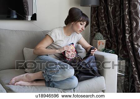 Woman searching contents of purse View Large Photo Image Stock Photograph - Woman searching contents of purse. Fotosearch