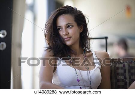 Woman sitting in a cafe View Large Photo Image Stock Photo - Woman sitting in a cafe. Fotosearch
