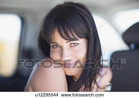 Picture - Woman sitting in a car. Fotosearch