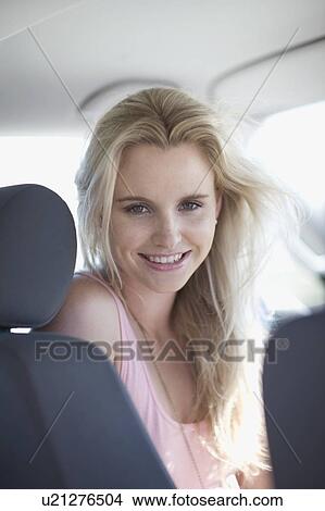 Picture - Woman sitting in a car. Fotosearch