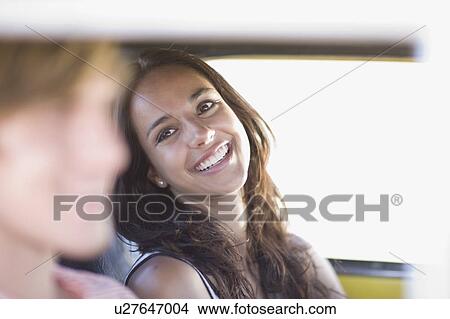 Picture - Woman sitting in a car. Fotosearch