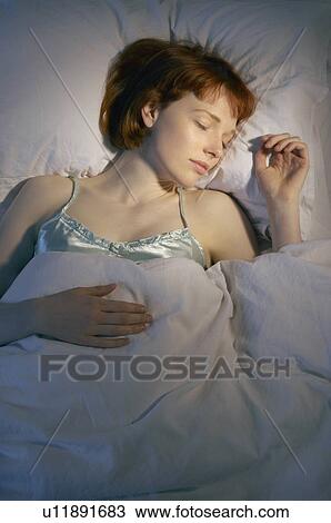 woman sleeping in bed View Large Photo Image Stock Image - woman sleeping in bed. Fotosearch