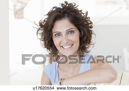 Picture - woman smiling at the camera. Fotosearch