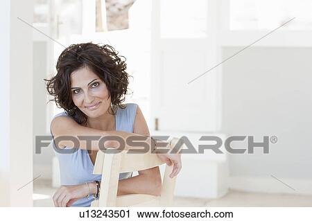 Stock Image - woman smiling at the camera. Fotosearch