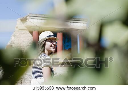 woman smiling in front of temple View Large Photo Image Stock Image - woman smiling in front of temple . Fotosearch