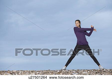 woman stretching on beach View Large Photo Image Picture - woman stretching on beach. Fotosearch