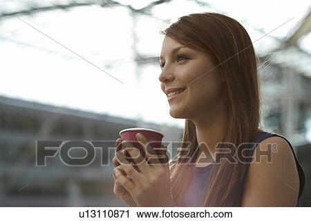 Woman with coffecup smiling View Large Photo Image Stock Image - Woman with coffecup smiling. Fotosearch