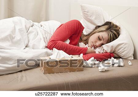 Woman with cold sleeping View Large Photo Image Stock Photo - Woman with cold sleeping. Fotosearch
